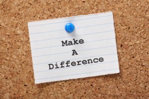 Note card saying “Make a difference”