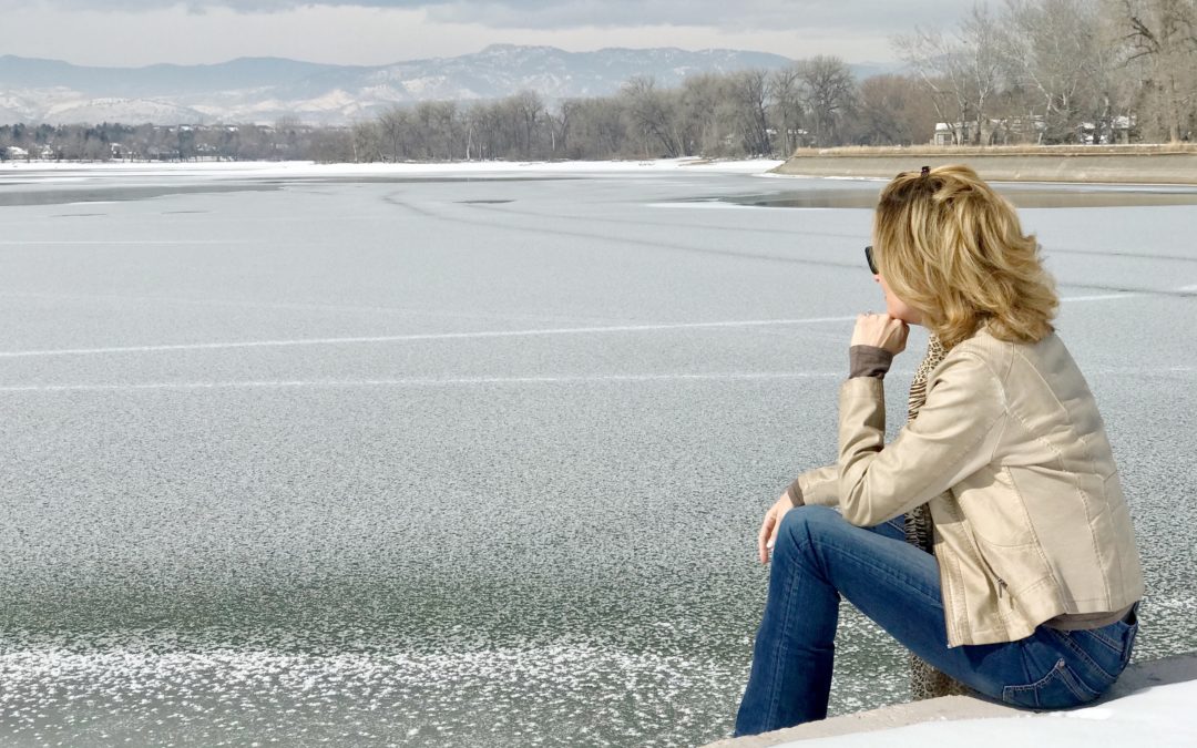 Woman looking at frozen lake