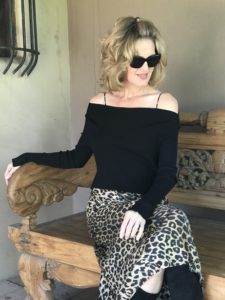 woman wearing leopard with black sweater