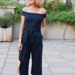 Lisa from MidlifeinBloom.com shows an off-the-shoulder, navy jumpsuit