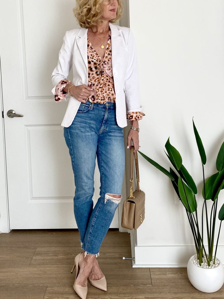 Lisa from Midlifeinbloom.com shows white blazer outfit for spring
