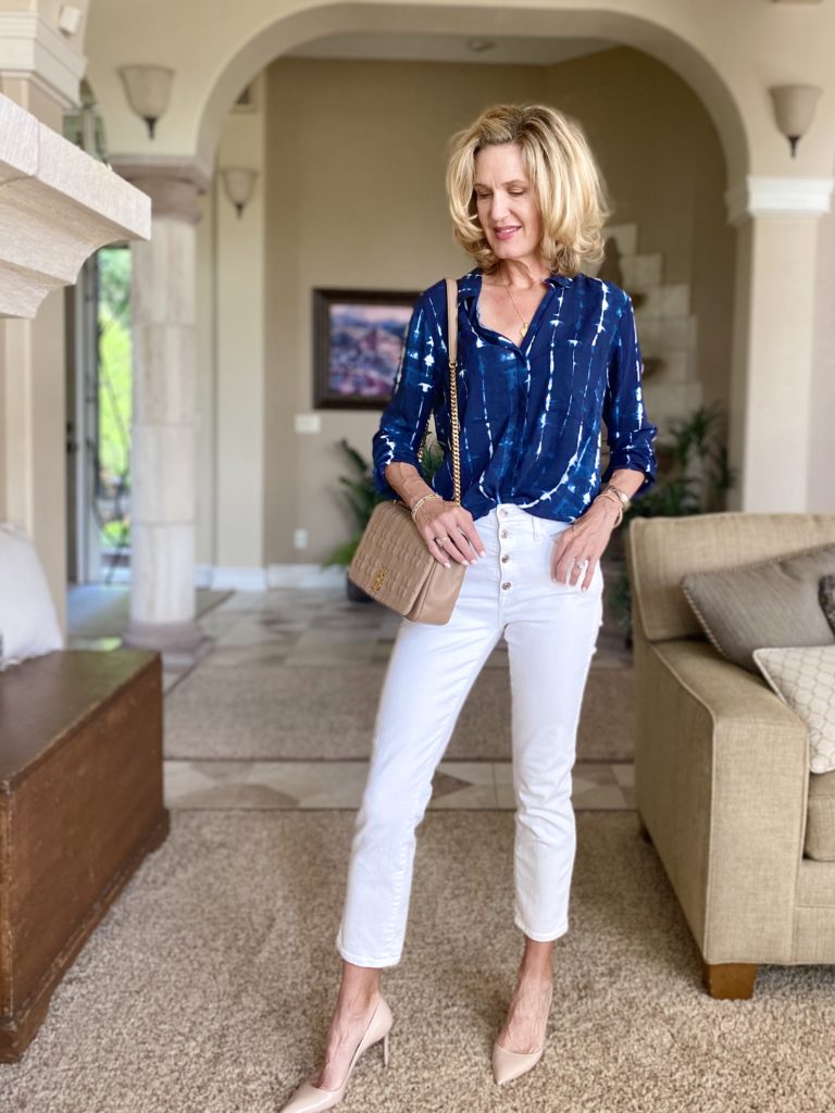 Lisa from midlifeinbloom.com shows a chic tie dye top with white jeans